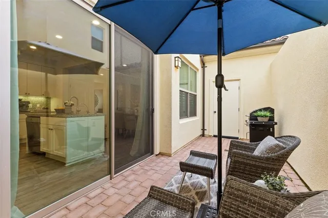a table with chairs and a stove top oven