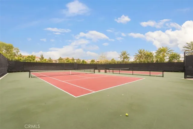 a view of a house with a yard and tree s