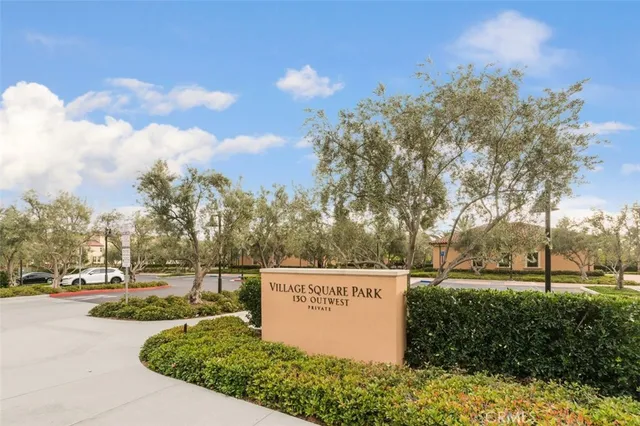 a row of palm trees and swimming pool in the backyard of a house