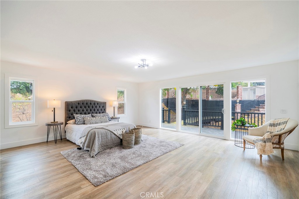 2225 Da Vinci Drive Riverside, CA 92506 - Photo 21 of 60 a bedroom with a bed and glass door