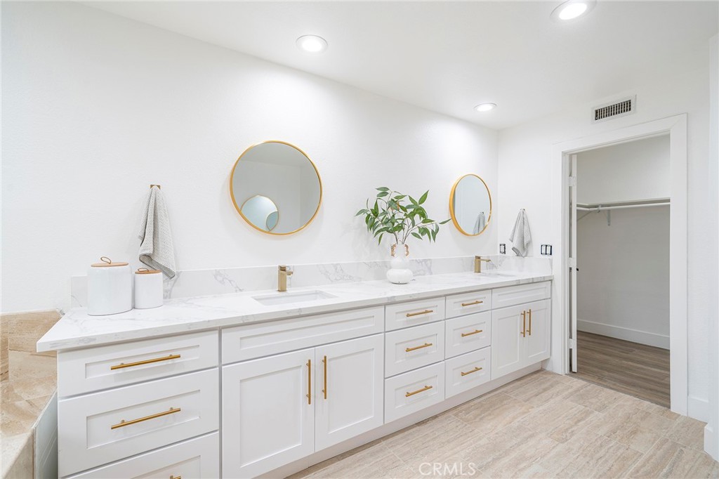 2225 Da Vinci Drive Riverside, CA 92506 - Photo 32 of 60 a bathroom with a granite countertop sink and a mirror