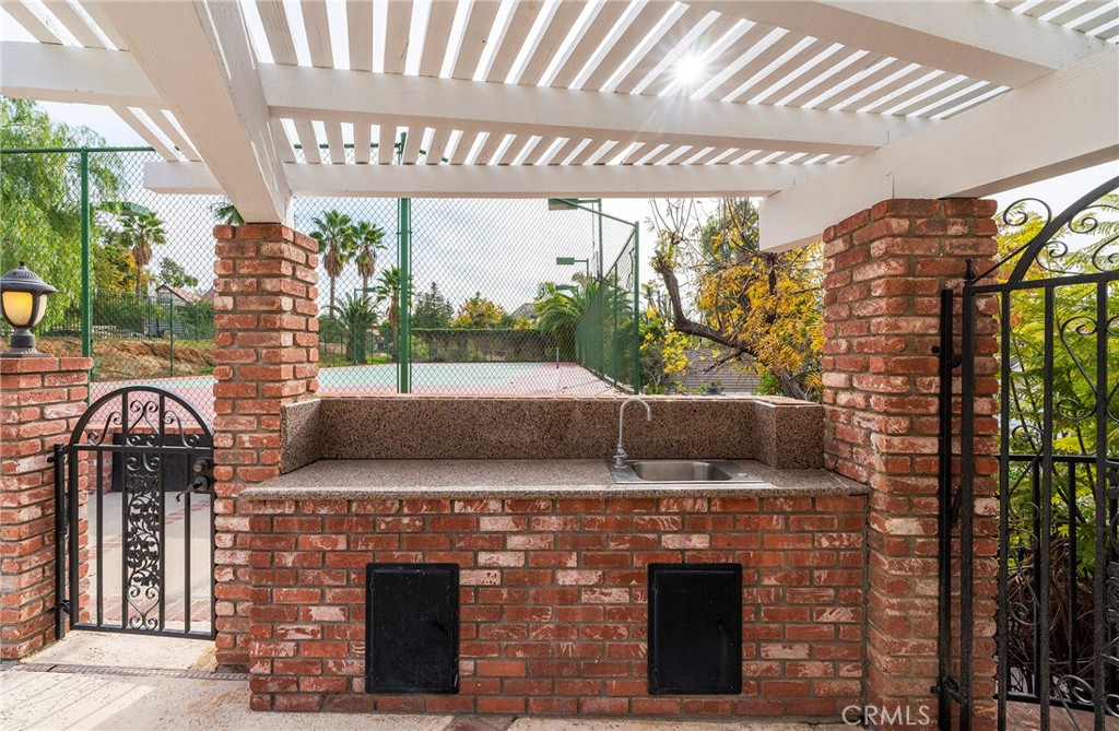 2225 Da Vinci Drive Riverside, CA 92506 - Photo 43 of 60 a view of a patio with table and chairs and potted plants