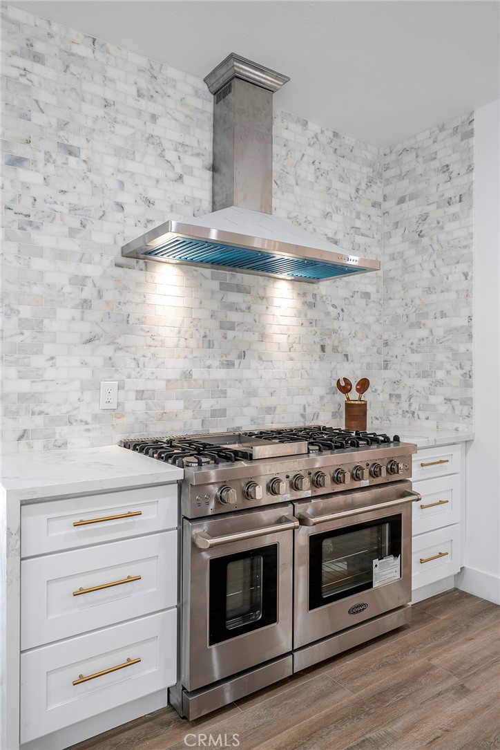 2225 Da Vinci Drive Riverside, CA 92506 - Photo 9 of 60 a stove top oven sitting inside of a kitchen