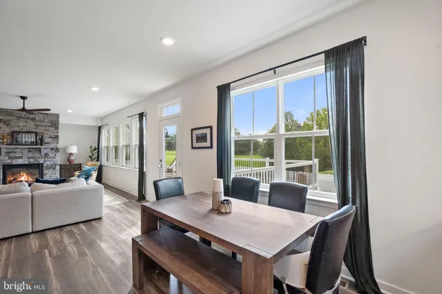a spacious bedroom with a bed and a chandelier