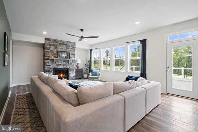 a view of balcony with furniture and wooden floor
