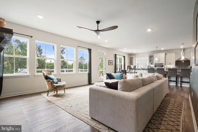 an aerial view of residential houses with outdoor space and city view