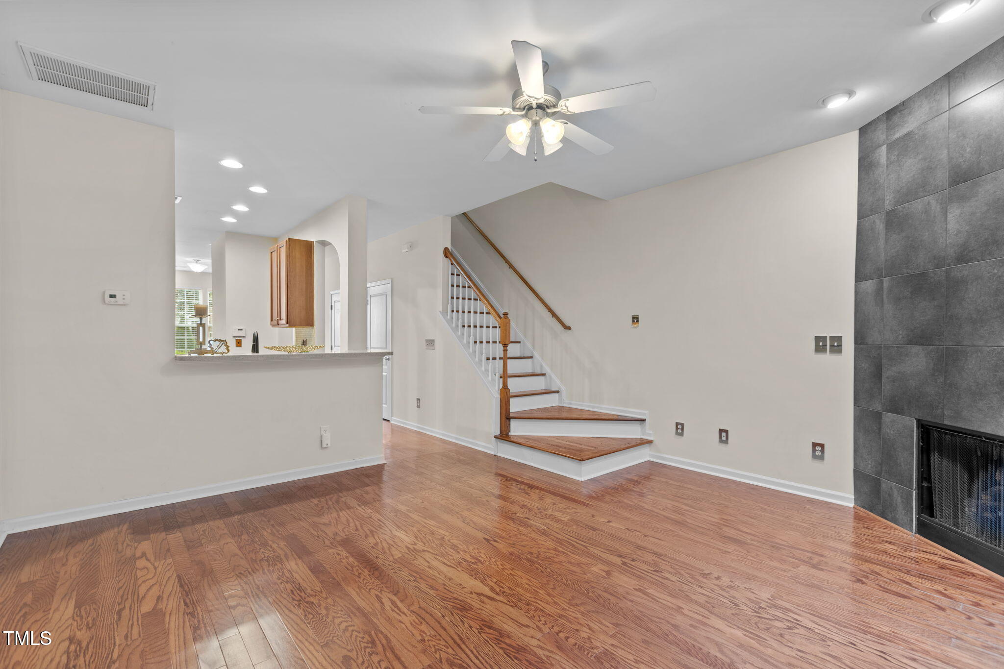 648 Cupola Drive Raleigh, NC 27603 - Photo 11 of 31 a view of an empty room with wooden floor and a window