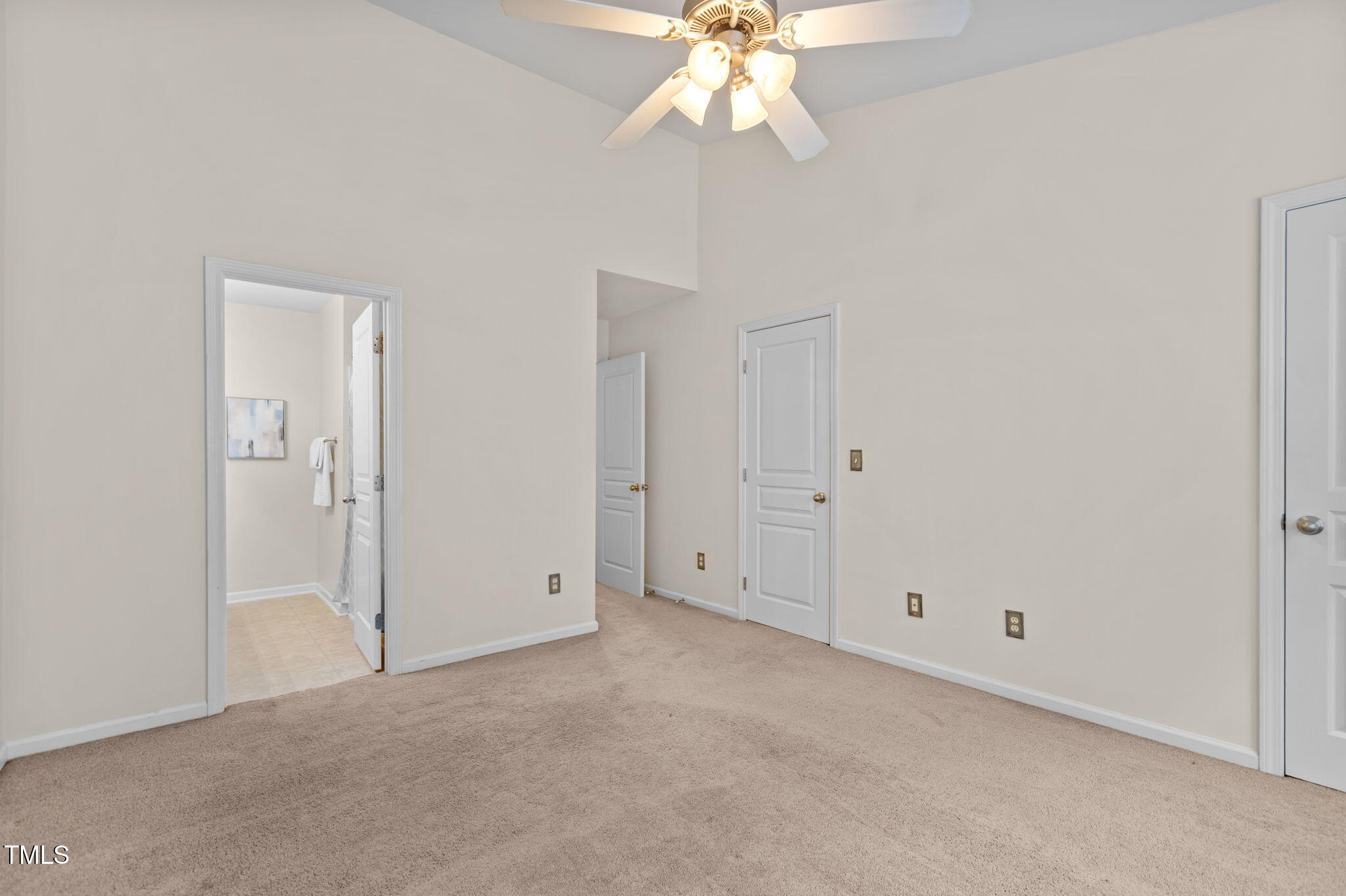 648 Cupola Drive Raleigh, NC 27603 - Photo 15 of 31 an empty room with a chandelier fan