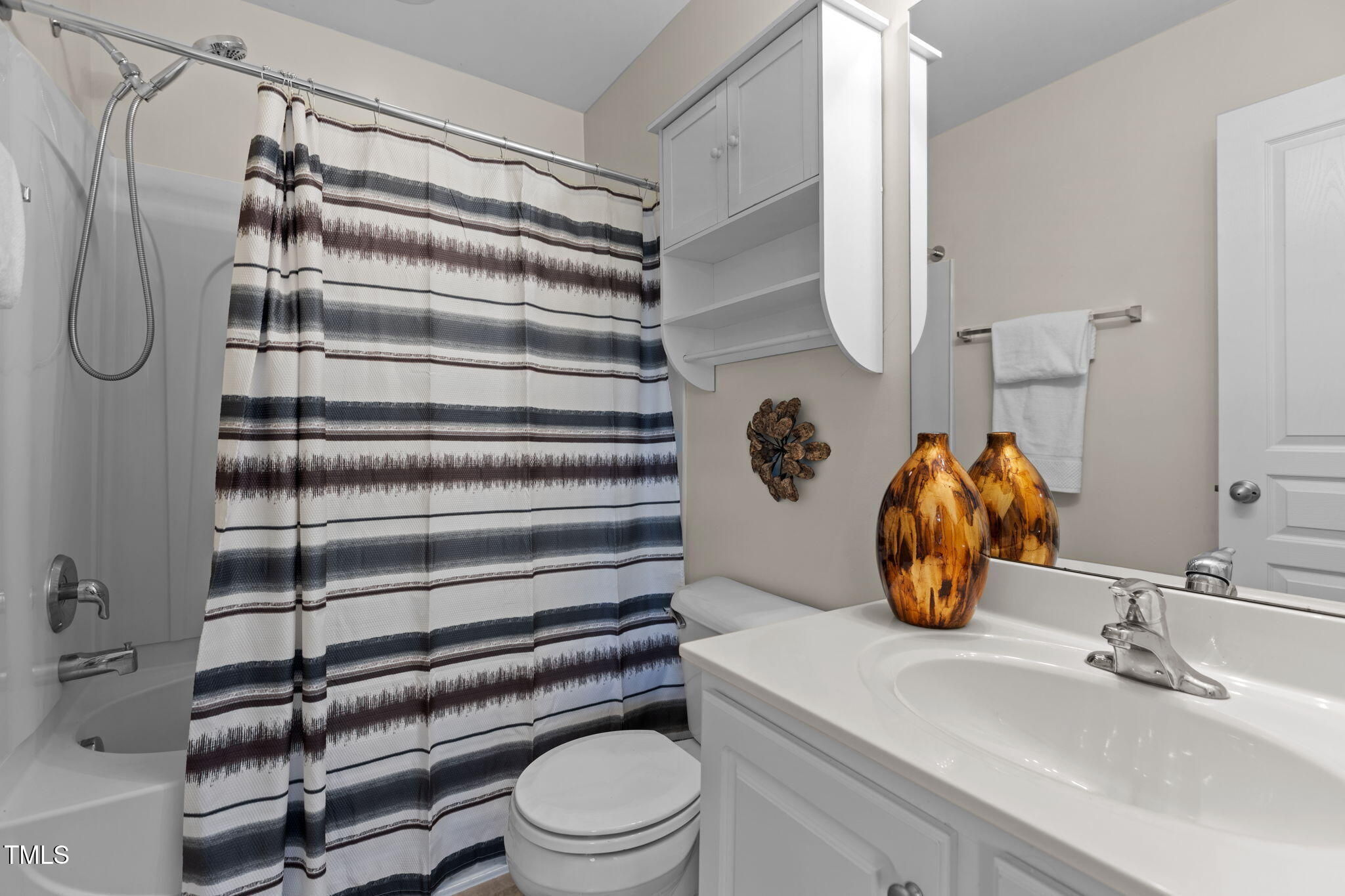 648 Cupola Drive Raleigh, NC 27603 - Photo 21 of 31 a bathroom with a sink toilet and shower
