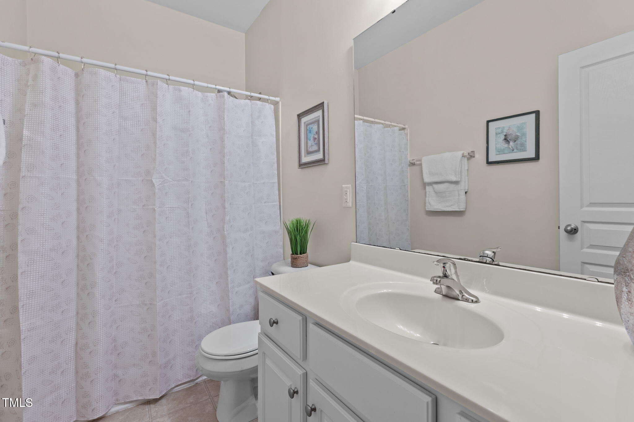 648 Cupola Drive Raleigh, NC 27603 - Photo 24 of 31 a bathroom with a sink toilet and a mirror