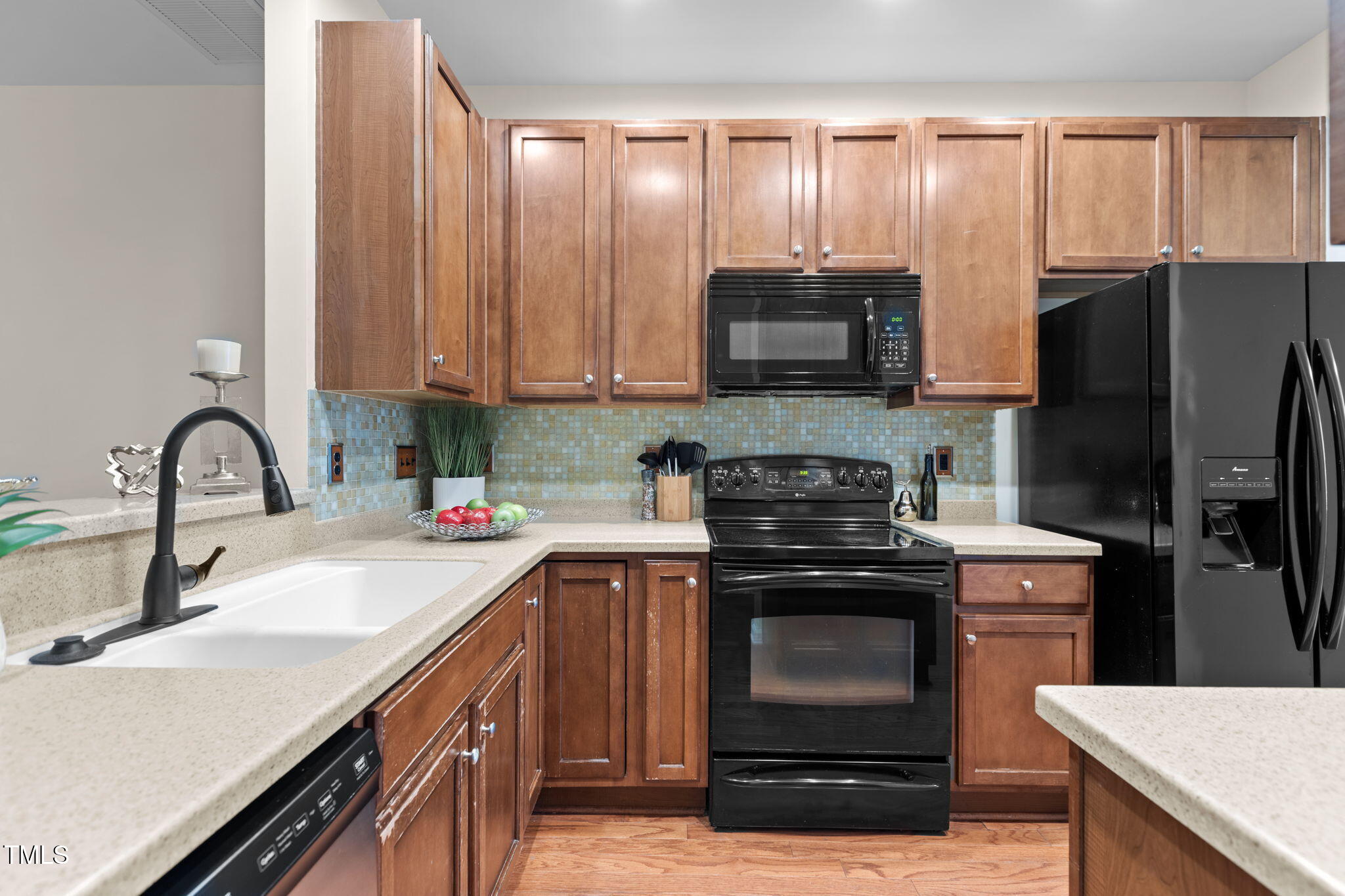 648 Cupola Drive Raleigh, NC 27603 - Photo 4 of 31 a kitchen with a sink stove and refrigerator