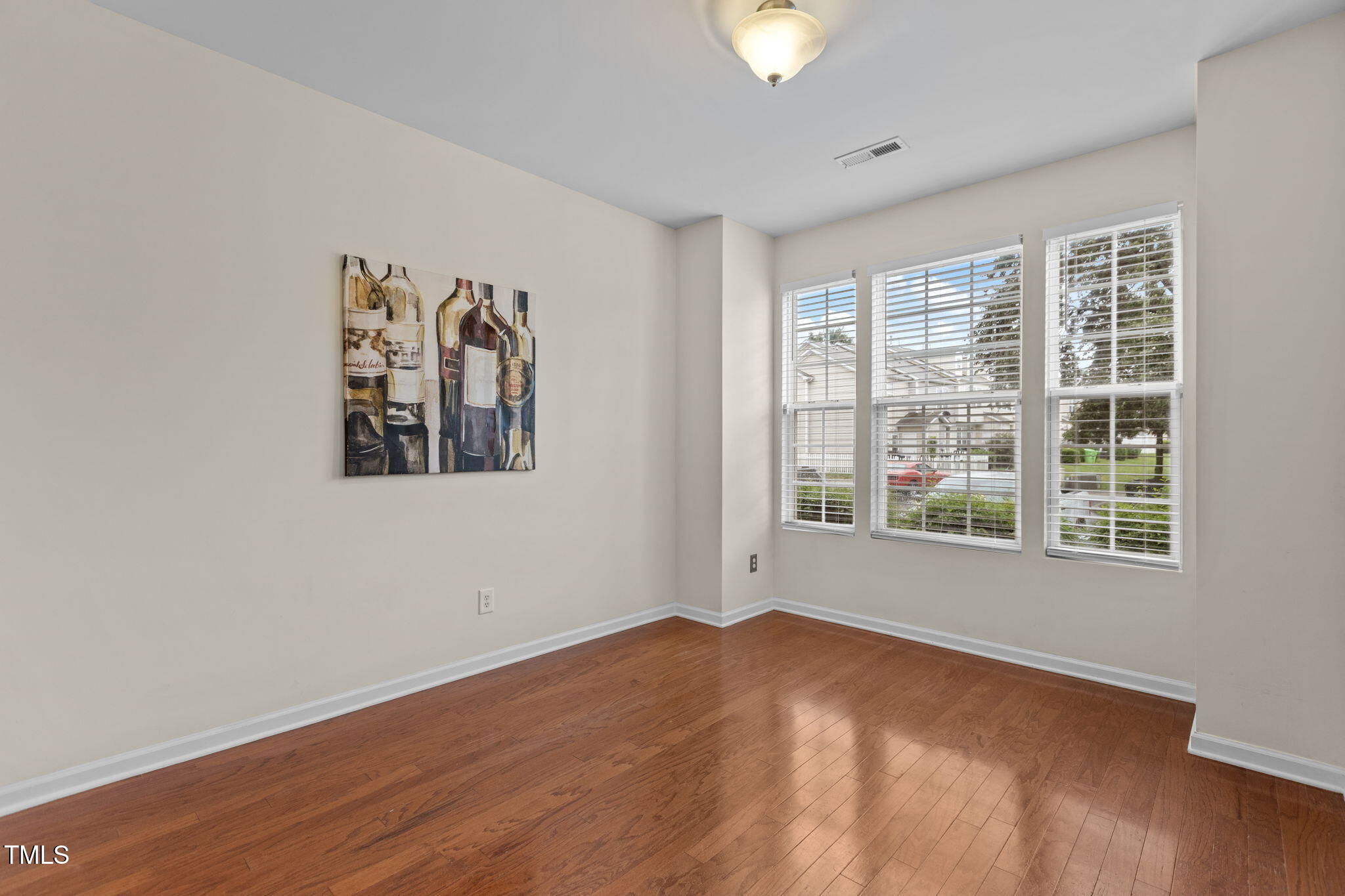 648 Cupola Drive Raleigh, NC 27603 - Photo 7 of 31 a view of a room with wooden floor and window