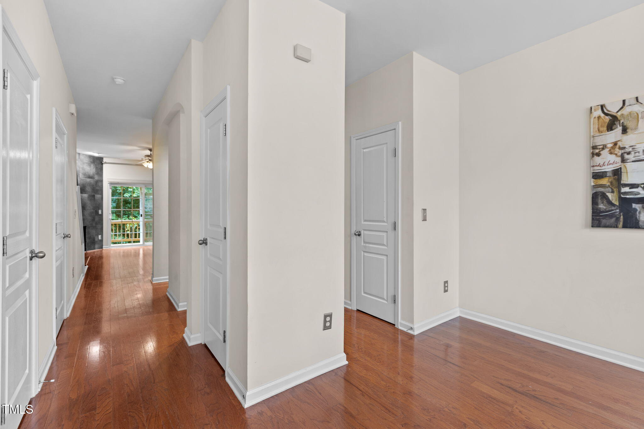 648 Cupola Drive Raleigh, NC 27603 - Photo 8 of 31 a view of a hallway with wooden floor