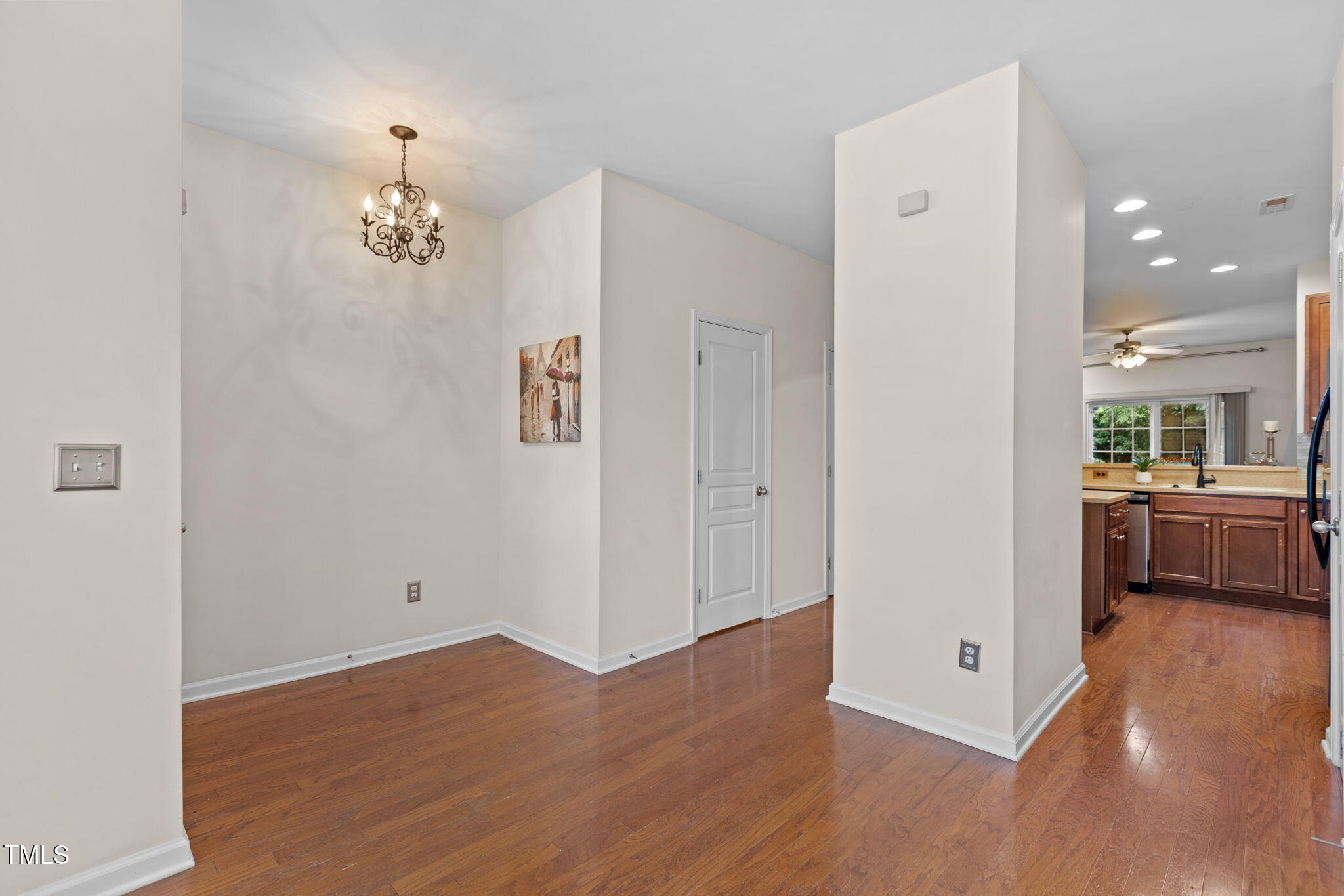 648 Cupola Drive Raleigh, NC 27603 - Photo 9 of 31 a view of a room with a hardwood floor and kitchen view