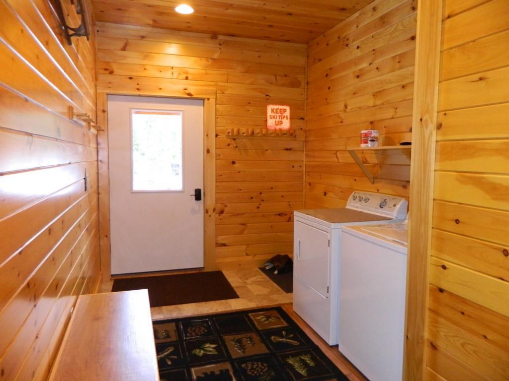 13 Hemlock Ridge Bethel, ME 04217 - Photo 16 of 35 Peg racks, bench and a large closet.