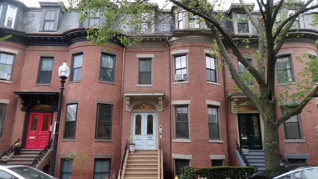 a front view of a multi story residential apartment building