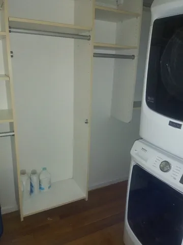 a room with a cabinets and wooden floor