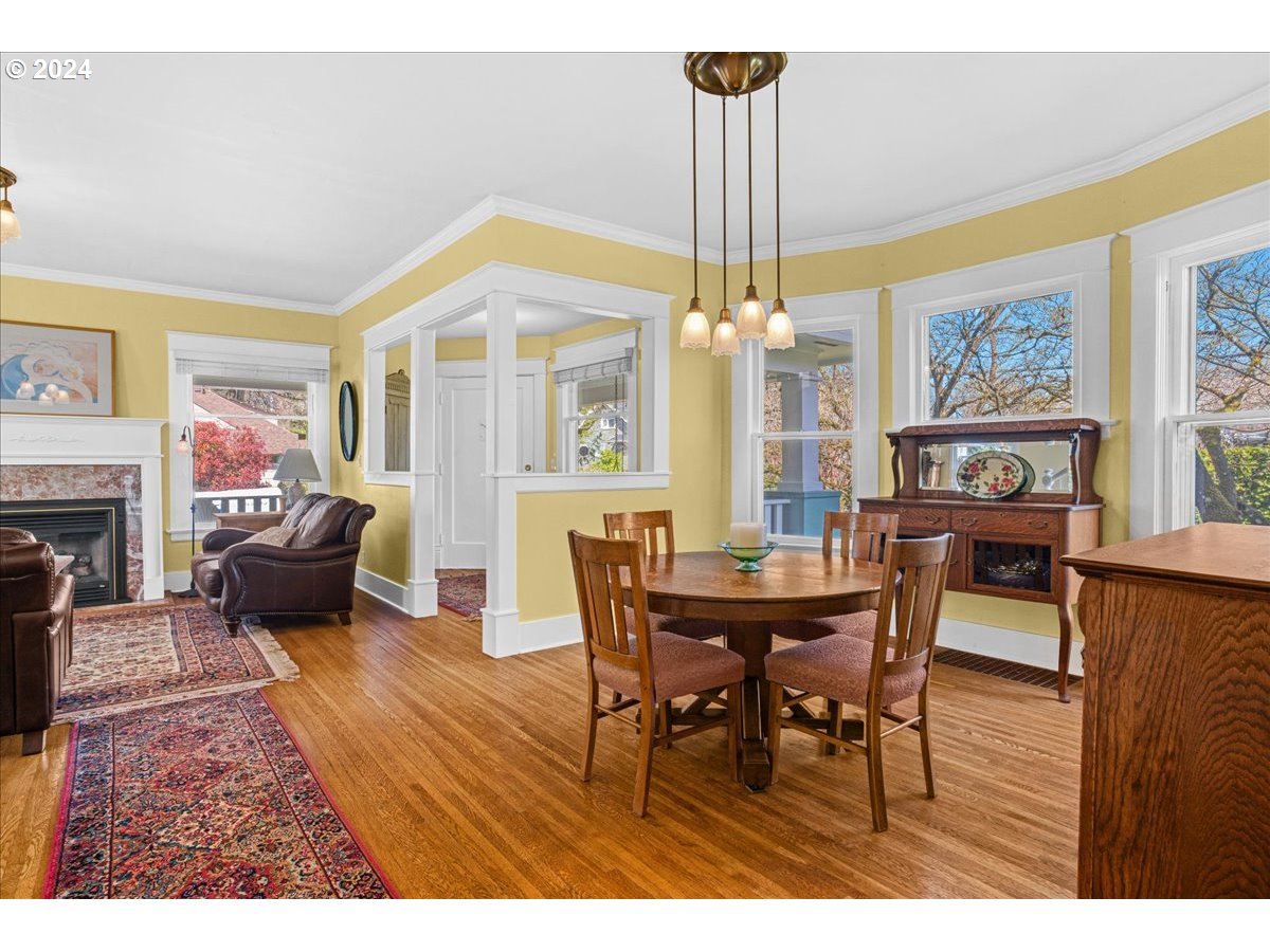 3752 Southeast Alder Street Portland, OR 97214 - Photo 11 of 44 a view of a dining room with furniture window and wooden floor