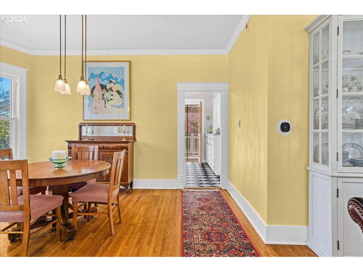 3752 Southeast Alder Street Portland, OR 97214 - Photo 12 of 44 a view of a dining room with a table and chairs