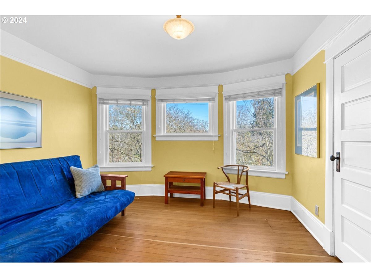 3752 Southeast Alder Street Portland, OR 97214 - Photo 22 of 44 a living room with furniture and a window