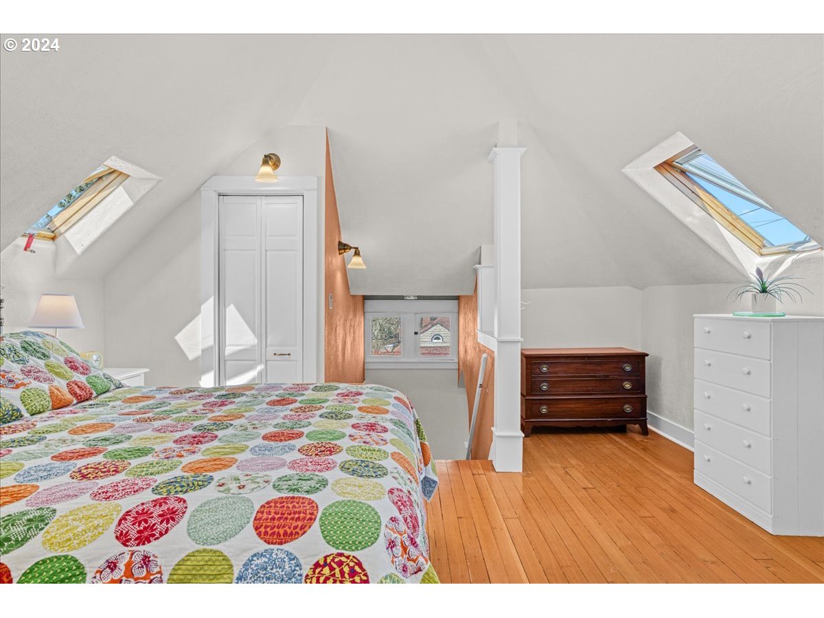 3752 Southeast Alder Street Portland, OR 97214 - Photo 29 of 44 a bedroom with a bed and a dresser