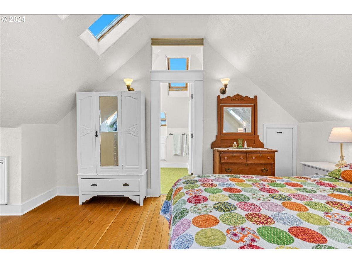 3752 Southeast Alder Street Portland, OR 97214 - Photo 30 of 44 a bedroom with a bed and a cabinets
