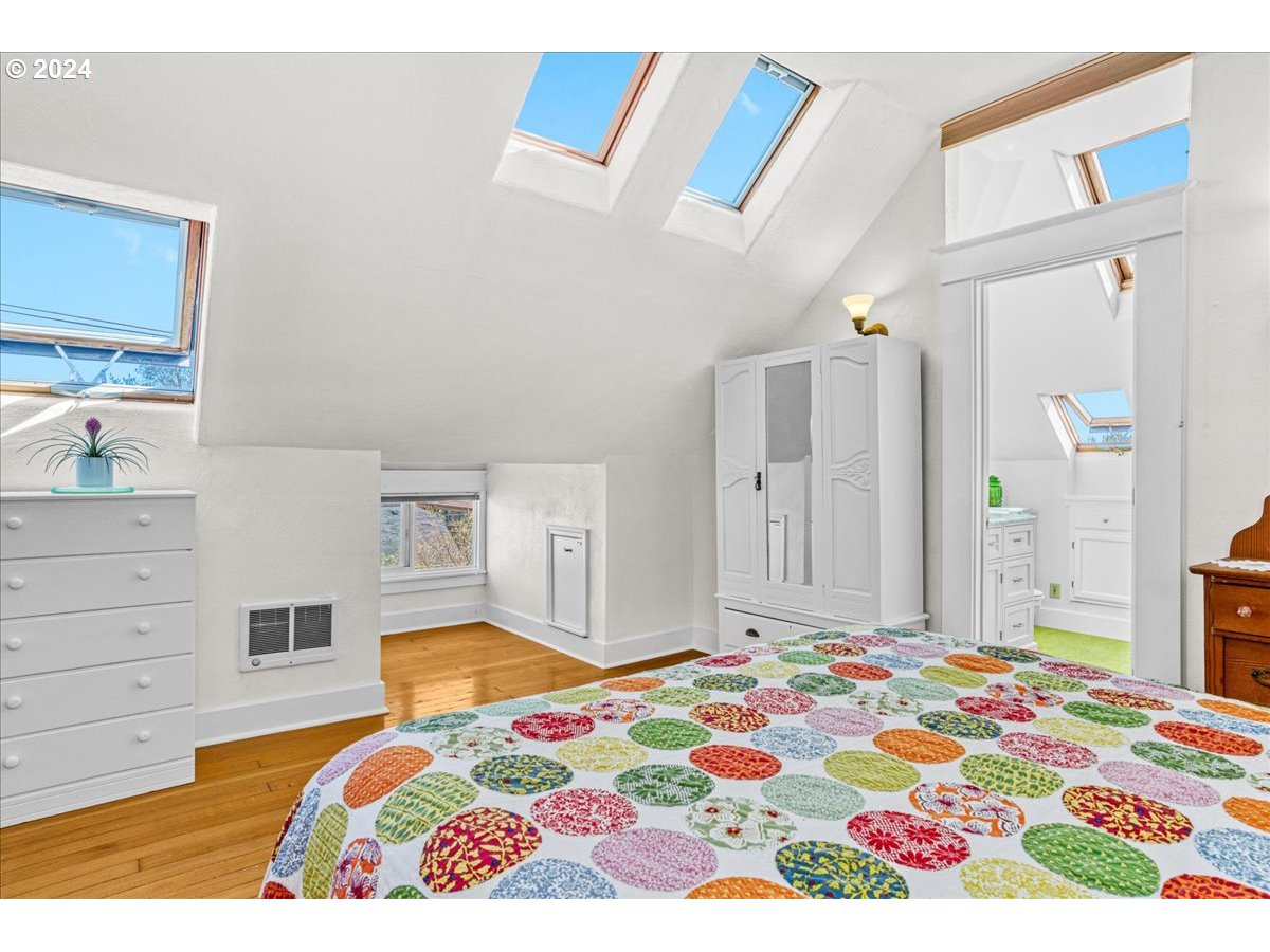 3752 Southeast Alder Street Portland, OR 97214 - Photo 31 of 44 a bedroom with bed and window