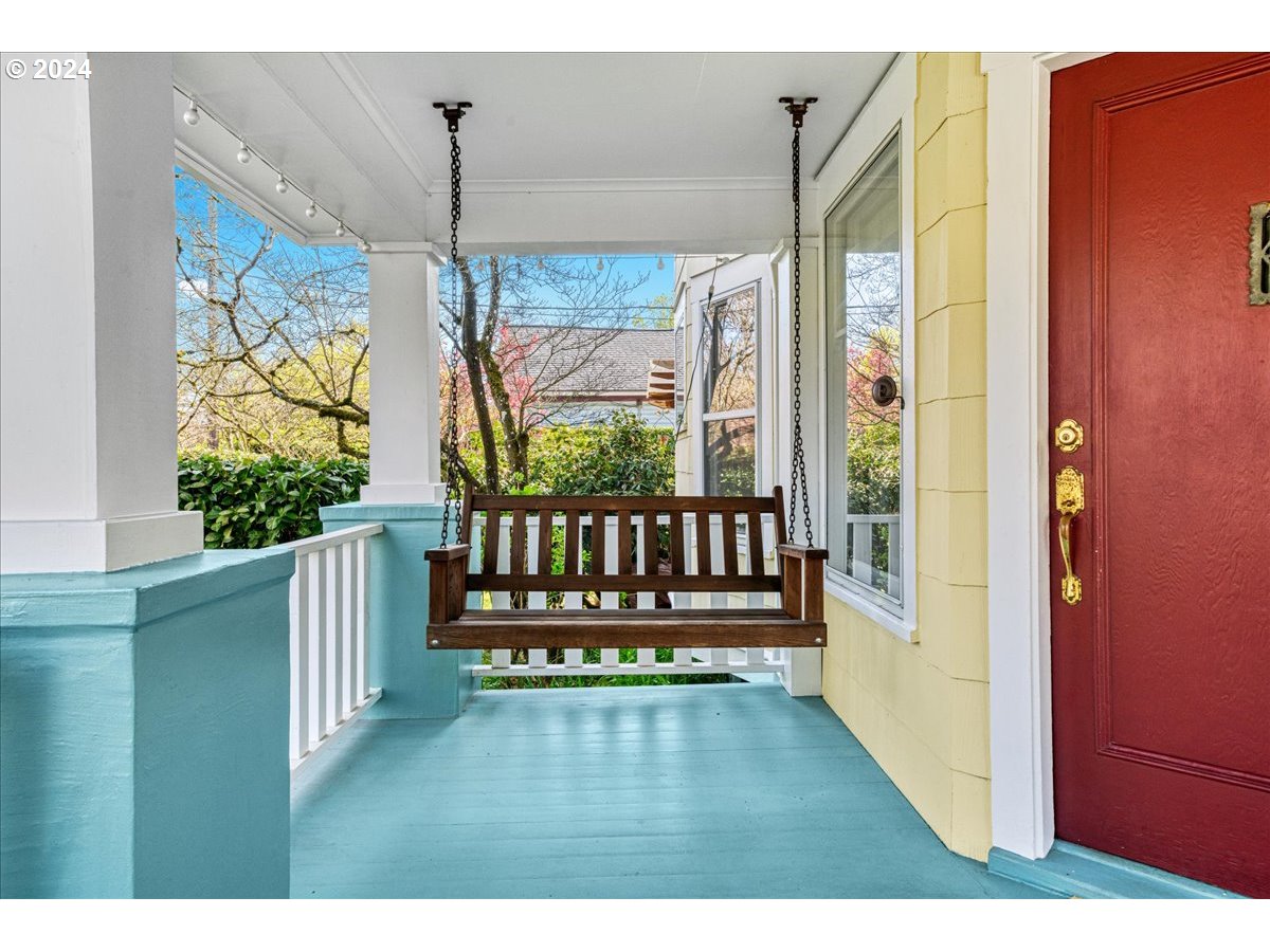 3752 Southeast Alder Street Portland, OR 97214 - Photo 4 of 44 a view of a porch with wooden floor