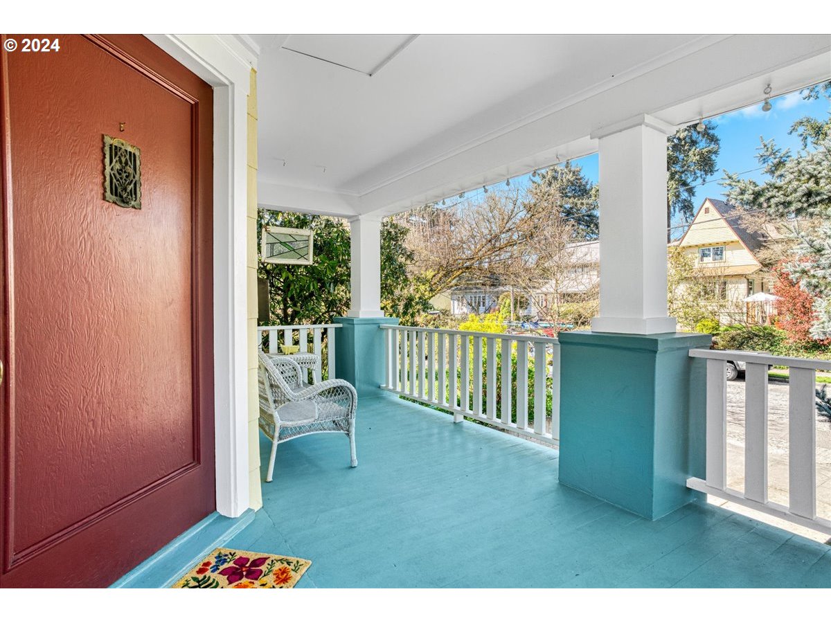 3752 Southeast Alder Street Portland, OR 97214 - Photo 5 of 44 a balcony with furniture and a yard