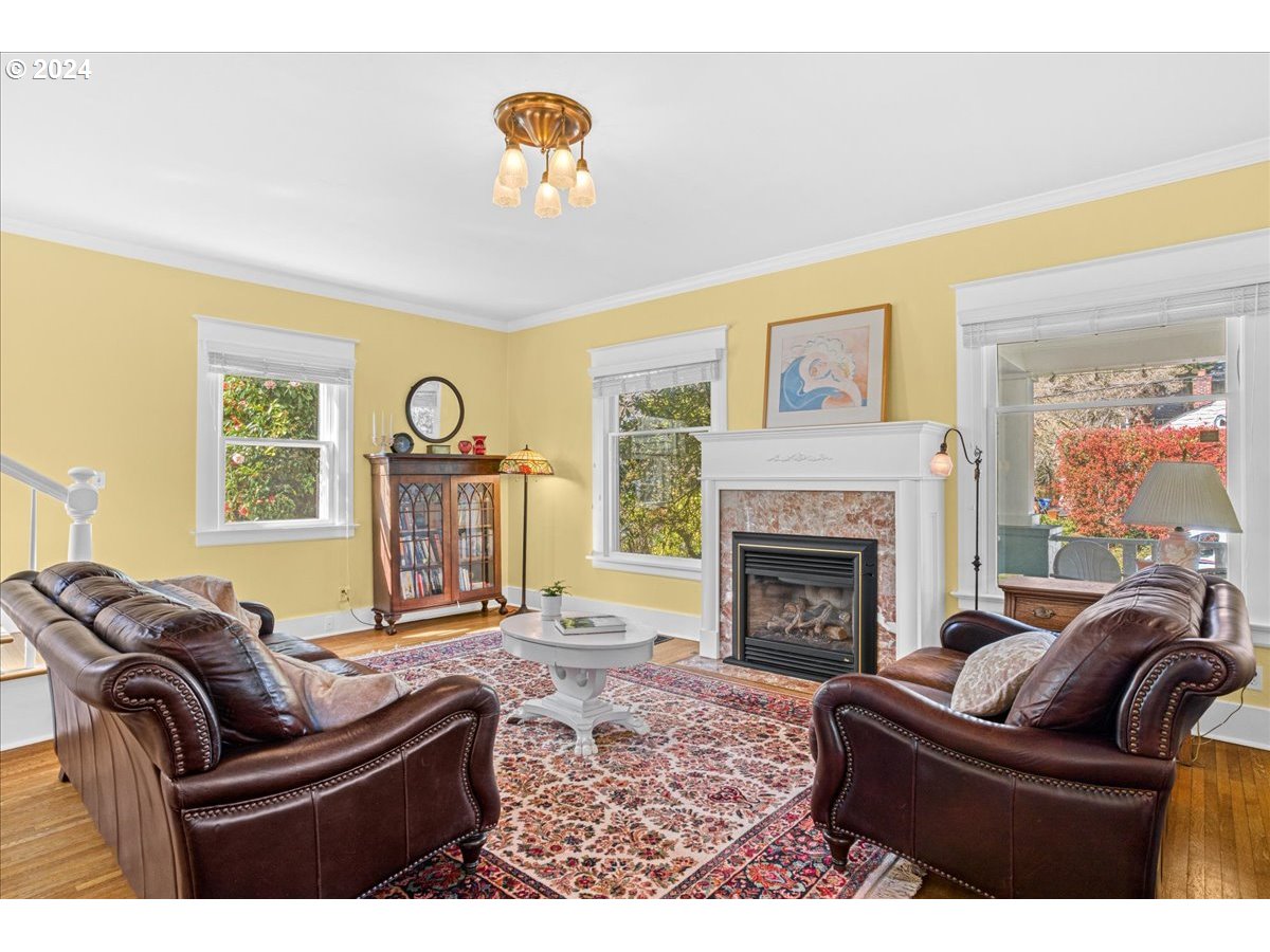 3752 Southeast Alder Street Portland, OR 97214 - Photo 6 of 44 a living room with furniture fireplace and a window