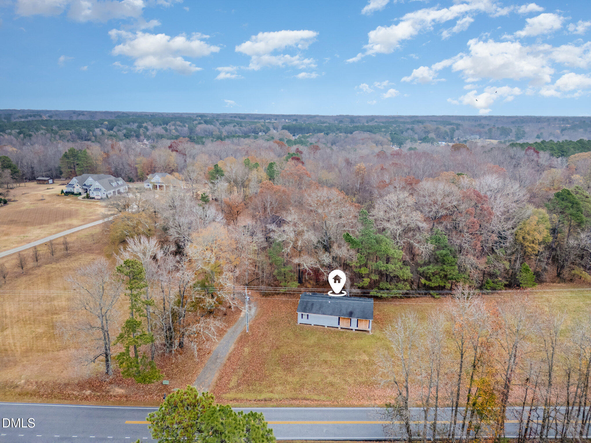 6801 Rock Service Station Road Raleigh, NC 27603 - Photo 4 of 36 an aerial view of a house with yard