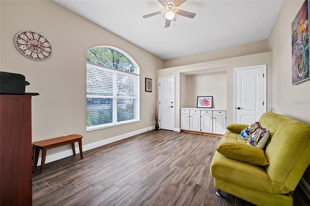 841 Grovesmere Loop Ocoee, FL 34761 - Photo 14 of 48 a living room with furniture and a window