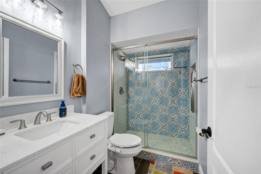 841 Grovesmere Loop Ocoee, FL 34761 - Photo 19 of 48 a bathroom with a sink toilet and shower