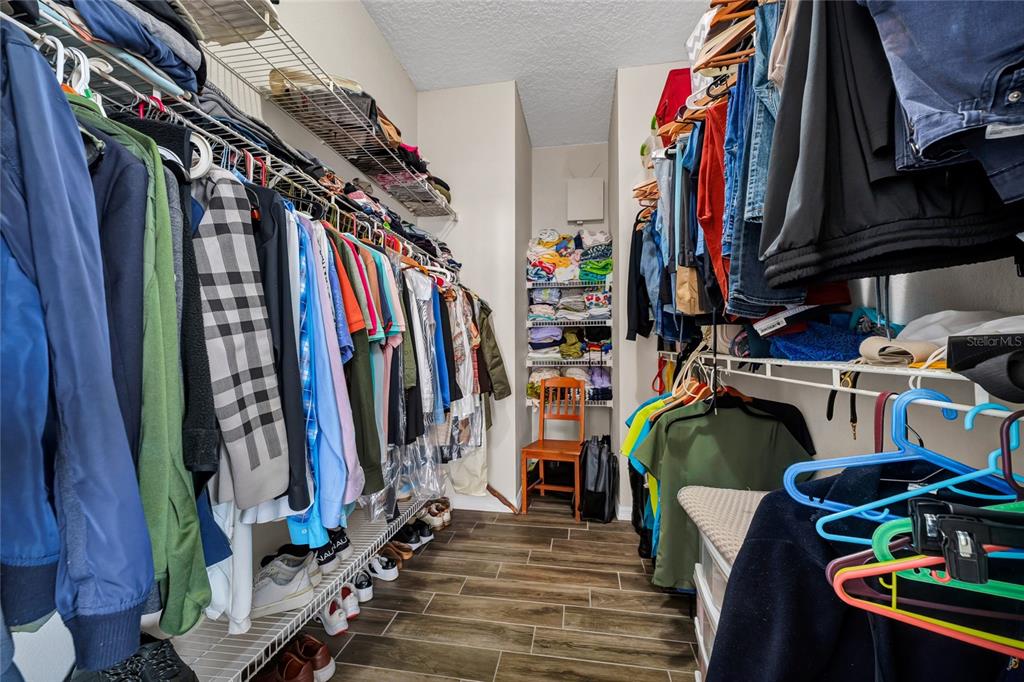 841 Grovesmere Loop Ocoee, FL 34761 - Photo 25 of 48 a view of walk in closet with clothes and shoes