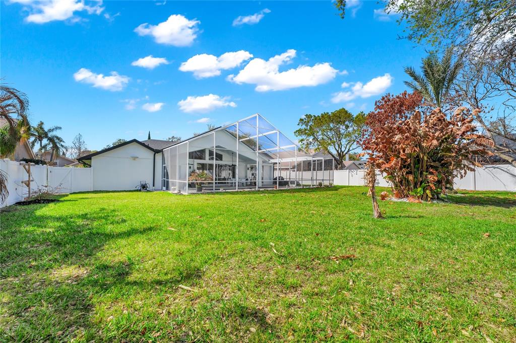 841 Grovesmere Loop Ocoee, FL 34761 - Photo 32 of 48 a view of a house with backyard and garden
