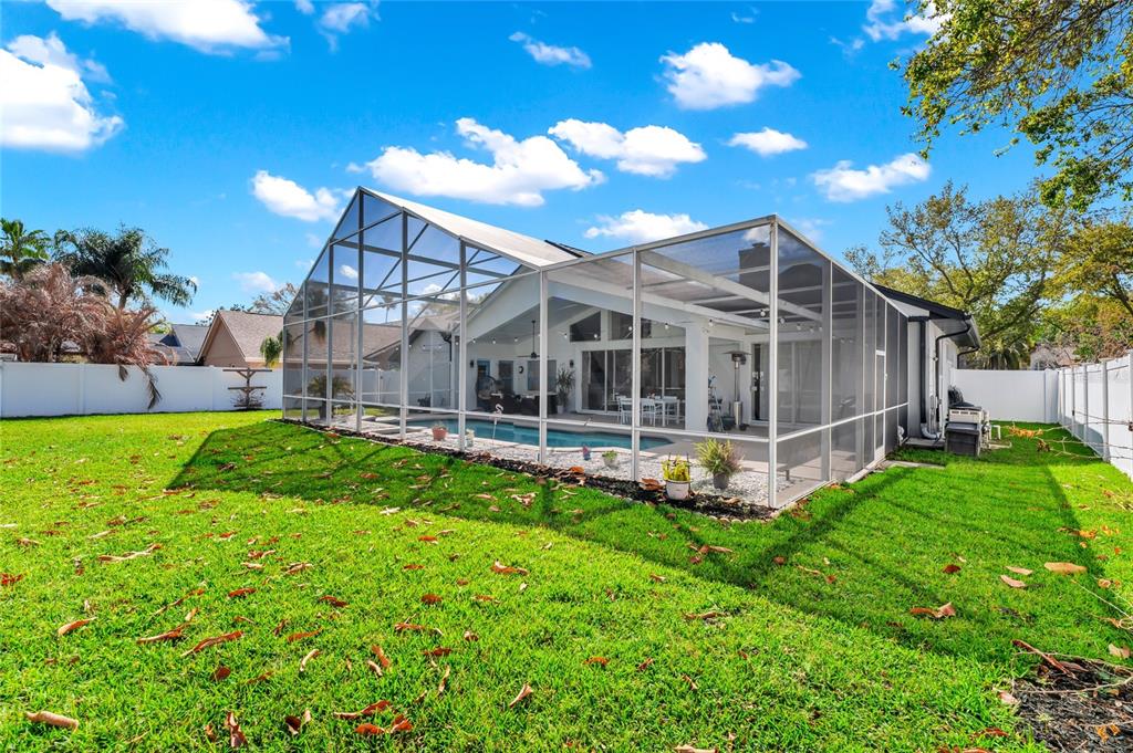 841 Grovesmere Loop Ocoee, FL 34761 - Photo 33 of 48 a view of a house with a backyard porch and sitting area