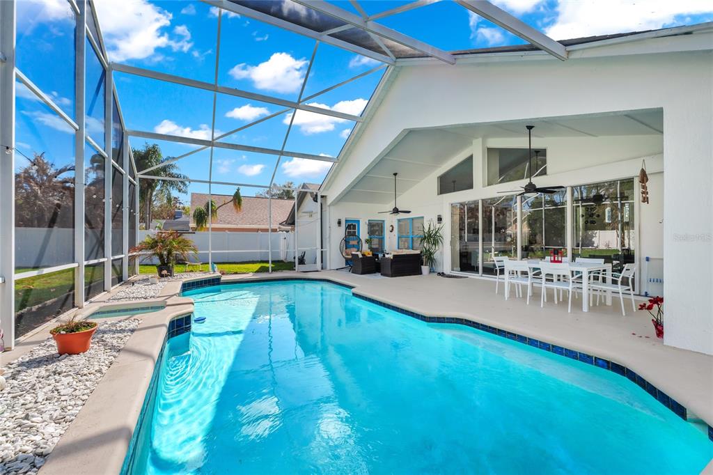 841 Grovesmere Loop Ocoee, FL 34761 - Photo 34 of 48 a view of a swimming pool with seating area