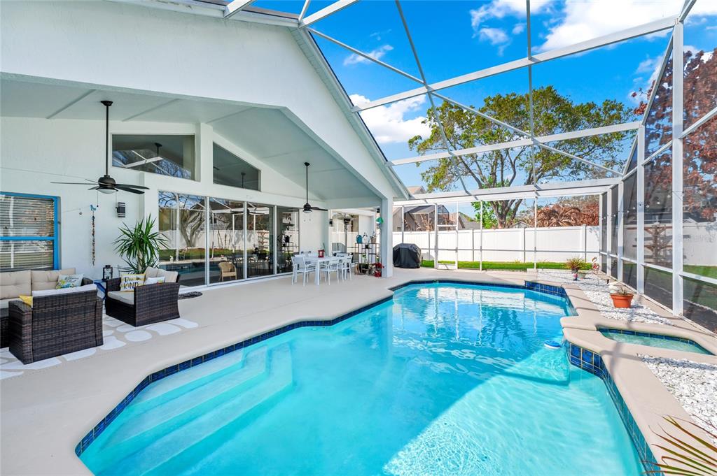 841 Grovesmere Loop Ocoee, FL 34761 - Photo 36 of 48 a view of a swimming pool with seating space
