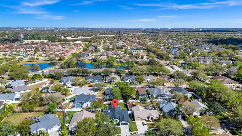 841 Grovesmere Loop Ocoee, FL 34761 - Photo 41 of 48 an aerial view of a city with lots of residential buildings