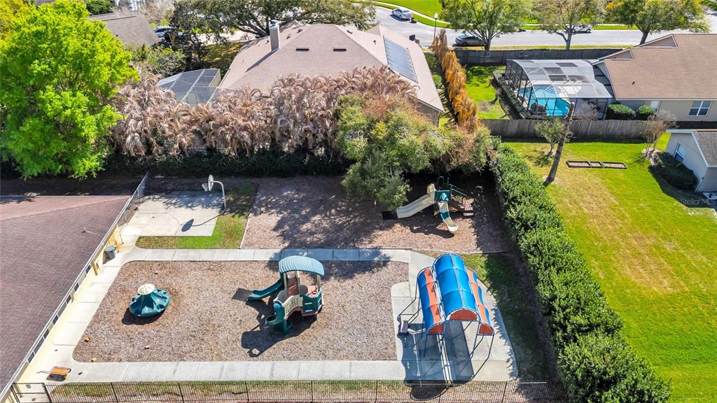 841 Grovesmere Loop Ocoee, FL 34761 - Photo 47 of 48 an aerial view of a house with swimming pool and large trees