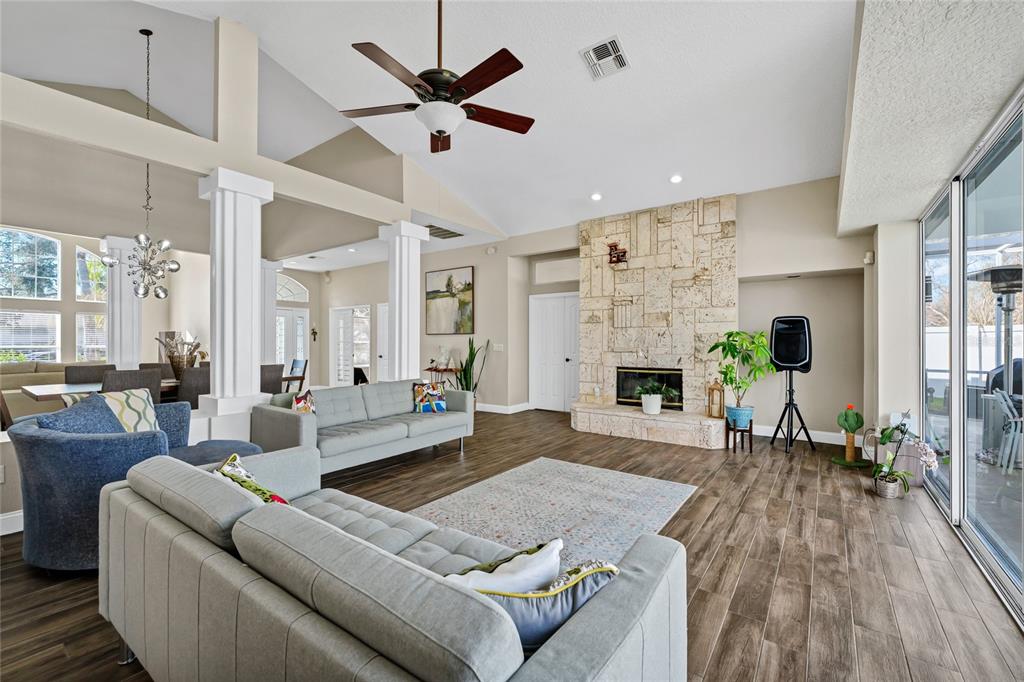 841 Grovesmere Loop Ocoee, FL 34761 - Photo 9 of 48 a living room with furniture and a fireplace