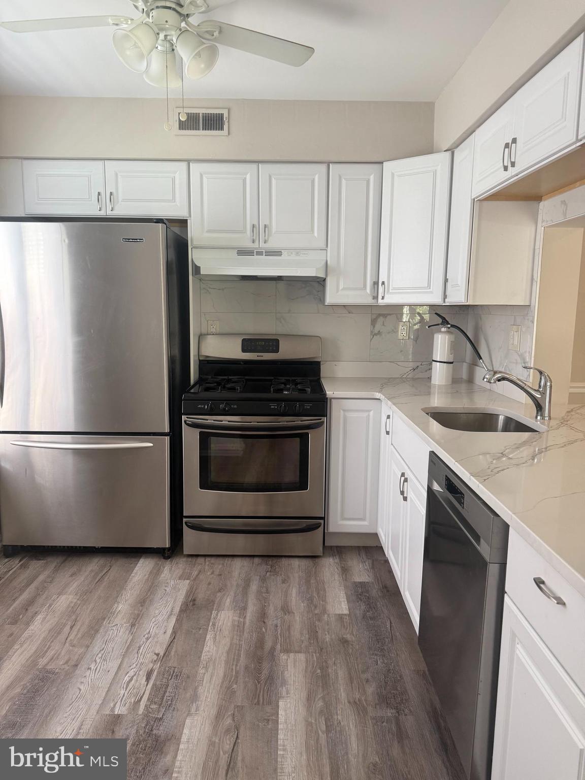 5702B Adelaide Drive Mount Laurel, NJ 08054 - Photo 5 of 22 a kitchen with a refrigerator sink and cabinets