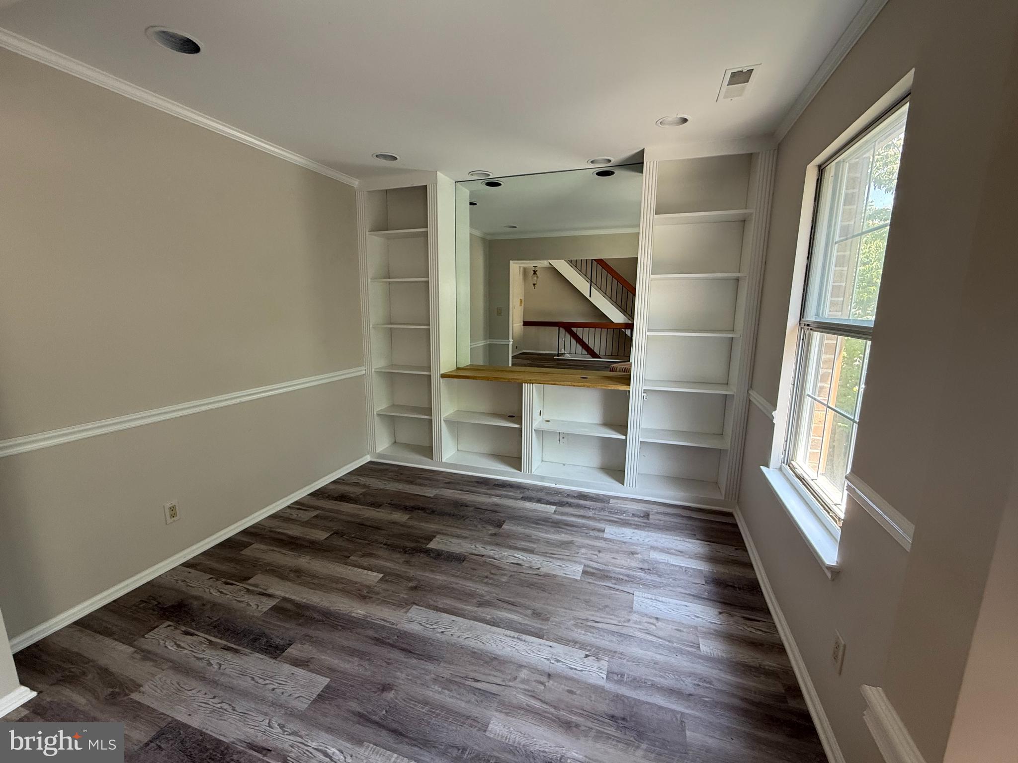 5702B Adelaide Drive Mount Laurel, NJ 08054 - Photo 8 of 22 a view of empty room with wooden floor and fan