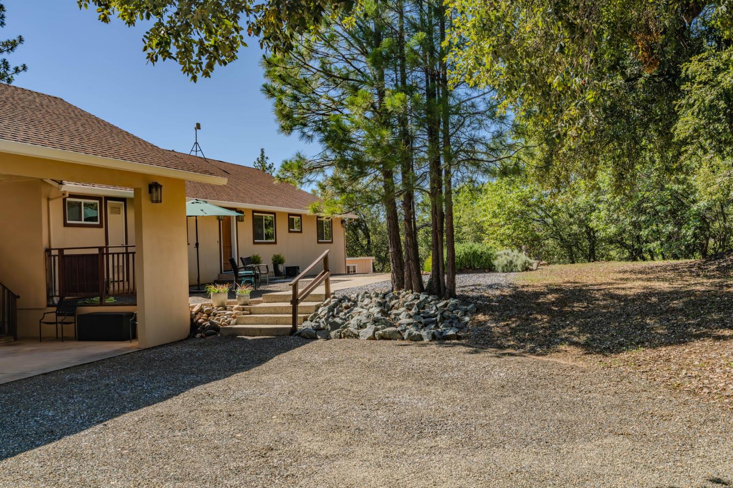 18299 West Clinton Road Jackson, CA 95642 - Photo 5 of 56 a front view of a house with a yard