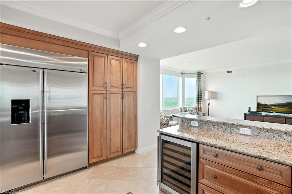 265 Indies Way, Unit 1605 Naples, FL 34110 - Photo 13 of 49 a bathroom with a granite countertop sink and a mirror