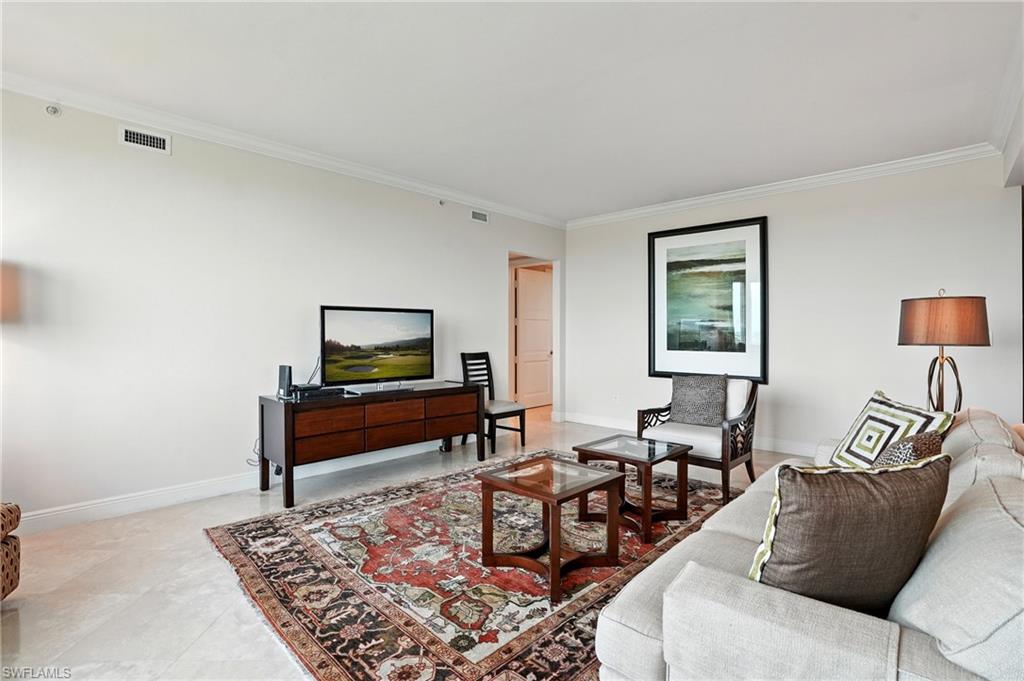 265 Indies Way, Unit 1605 Naples, FL 34110 - Photo 16 of 49 a living room with furniture and a rug
