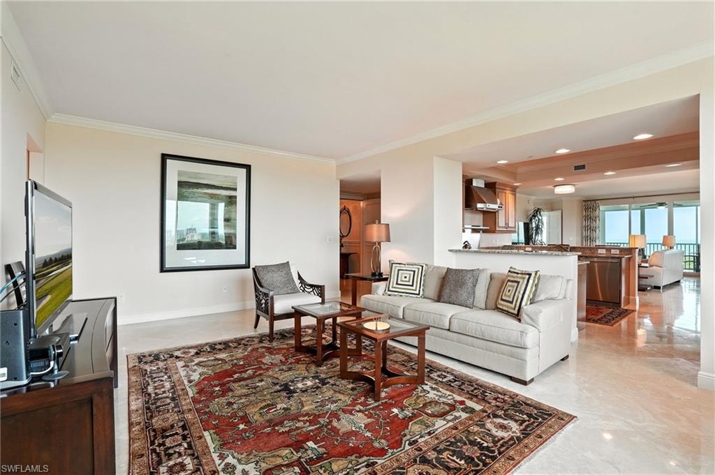 265 Indies Way, Unit 1605 Naples, FL 34110 - Photo 17 of 49 a living room with furniture and a flat screen tv