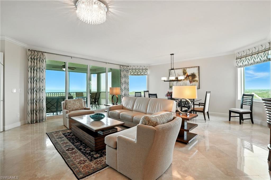 265 Indies Way, Unit 1605 Naples, FL 34110 - Photo 2 of 49 a living room with furniture and a large window