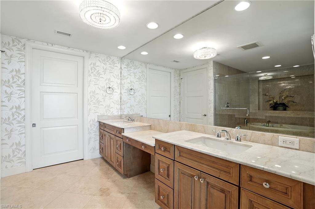 265 Indies Way, Unit 1605 Naples, FL 34110 - Photo 23 of 49 a bathroom with a granite countertop sink mirror and double
