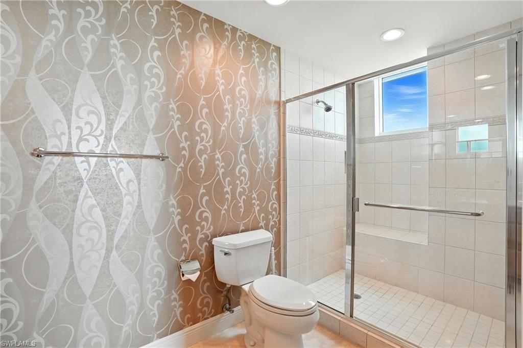 265 Indies Way, Unit 1605 Naples, FL 34110 - Photo 28 of 49 a bathroom with a toilet and a shower